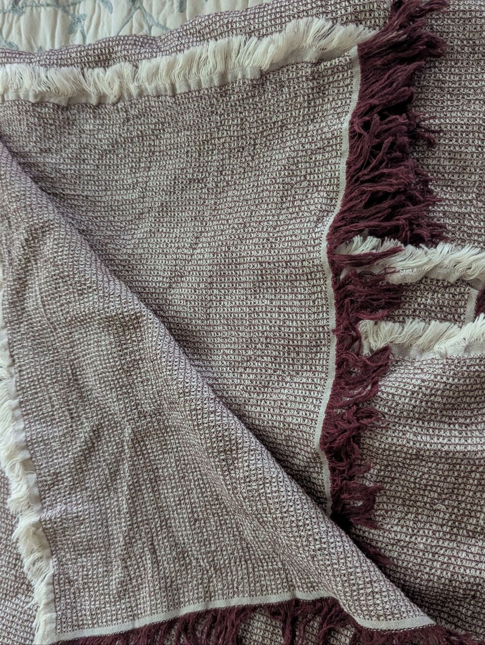 50 by 70 Elvang daisy throw blanket in deep red cotton linen blend - Picture 3 of 4